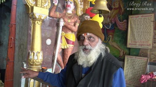 Priest of the temple explaining the pastimes of the place at Hanuman Garhi Temple, Vrindavan.