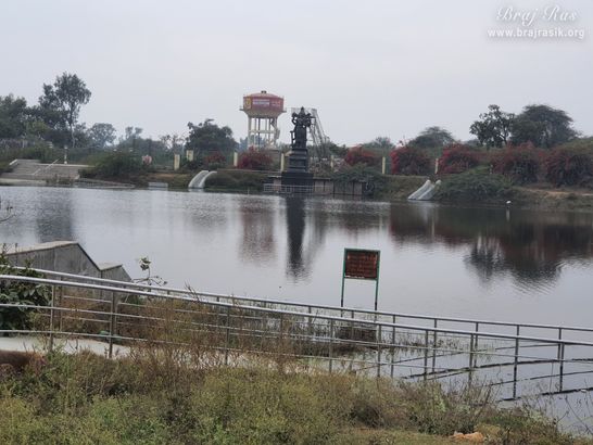 Beautiful waters of Sankarshan Kund and statue of Lord Hari at Anyor, Govardhan.