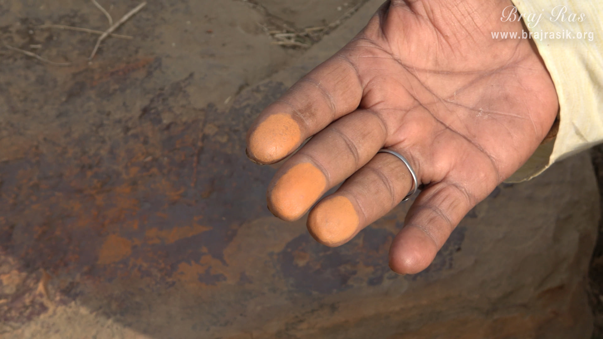 A close view of a Brajwasi showing Sindur (vermillion) after rubbing his fingers on Sinduri Shila at Govardhan.