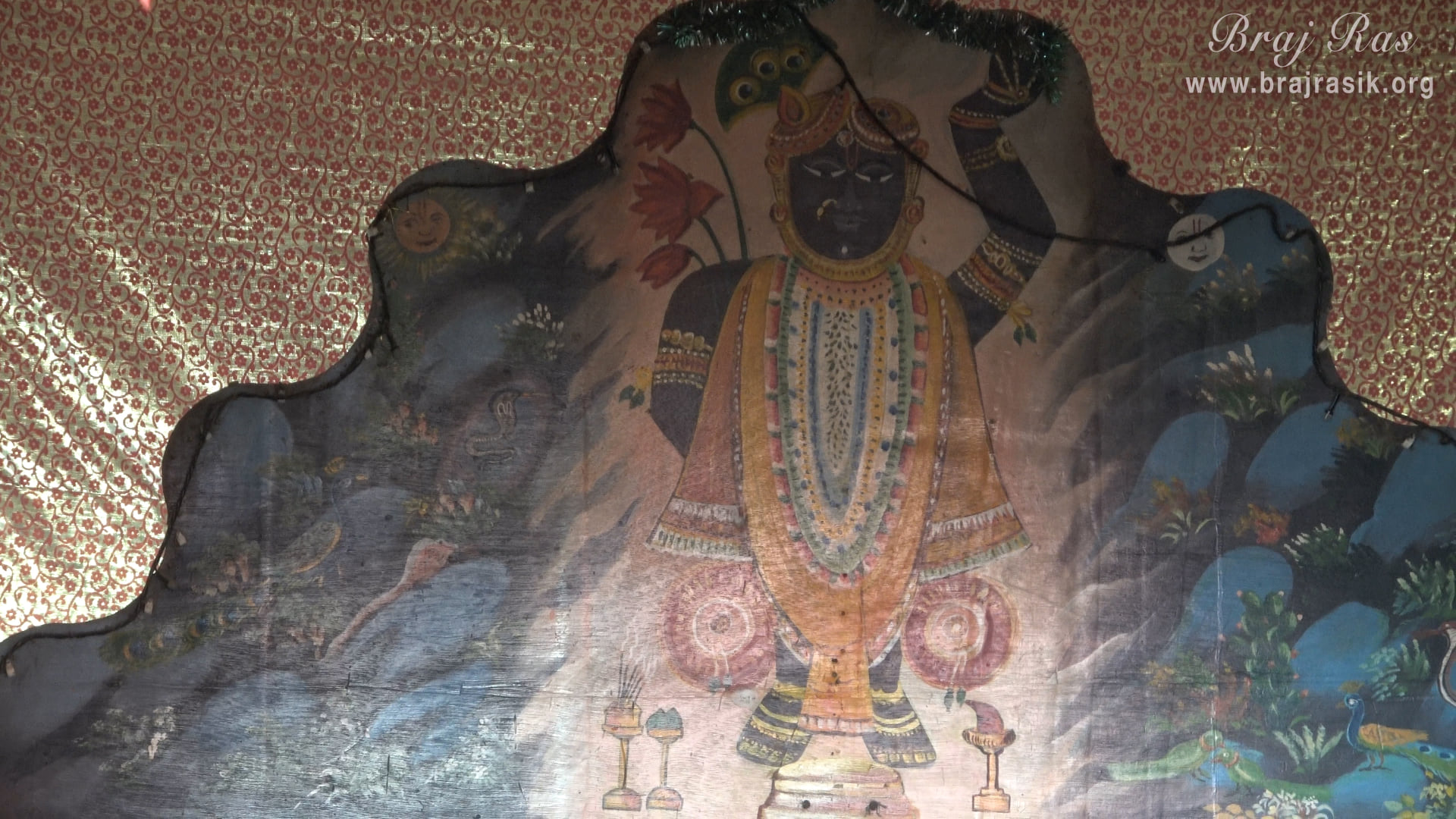 Shrinathji is depicted on the temple wall of Punchari Ka Lautha in Govardhan.