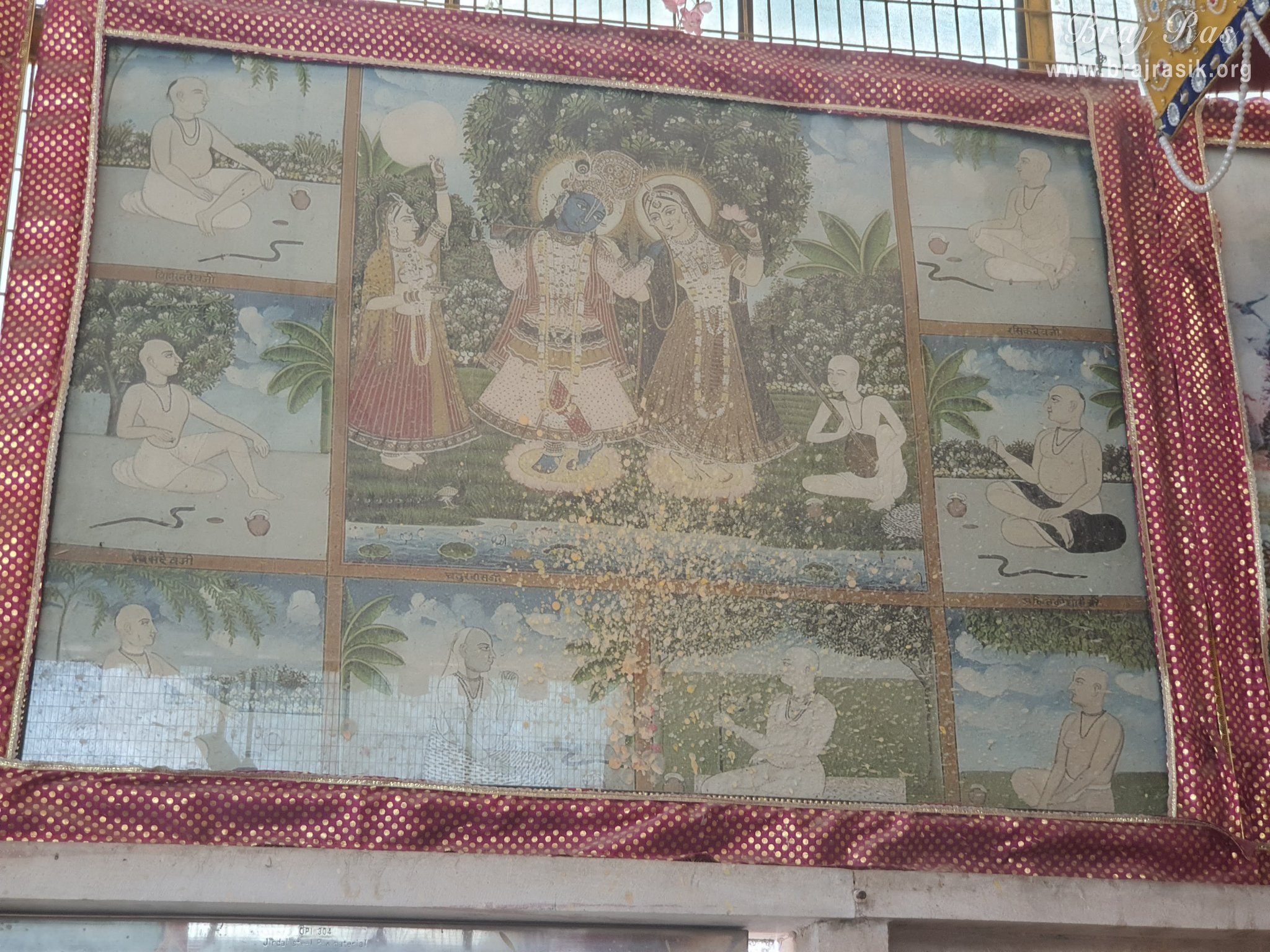 Close view of a painting of eight Acharyas of Swami Haridas tradition along with Shri Radha Krishn at Radha Bavdi in Vrindavan.