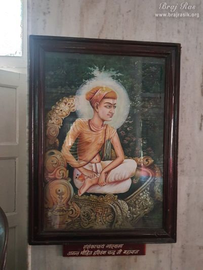 A painting of Shri Hita Harivansh Mahaprabhu is placed on a wall in Shri Hita Mahal, Vrindavan
