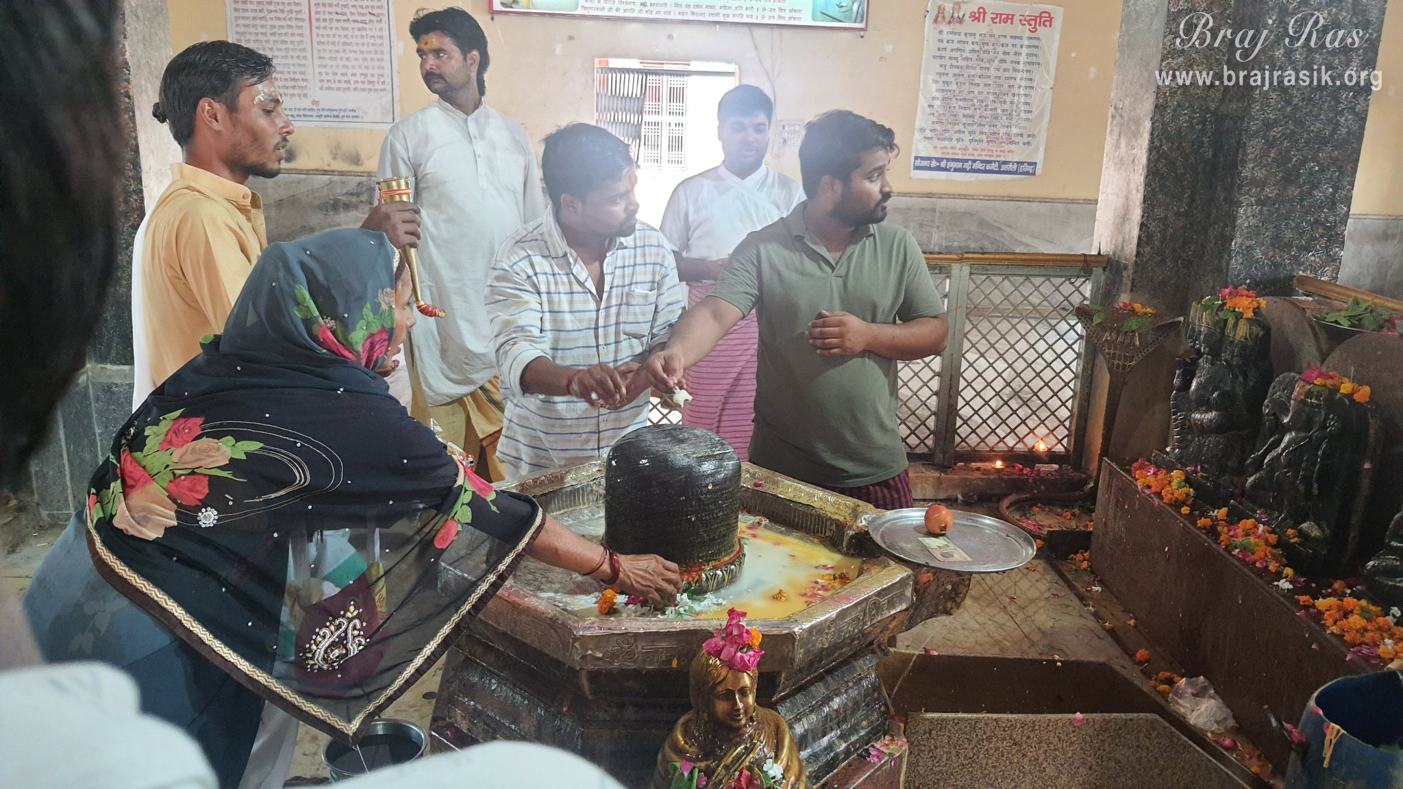 Devotees and priest worshipping Lord Chintaharan in Chintaharan Mahadev Temple in Gokul Mahavan.