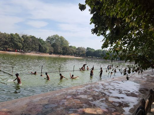 Devotees taking a dip at Raman Kund in Ramanreti, Gokul, Mahavan.