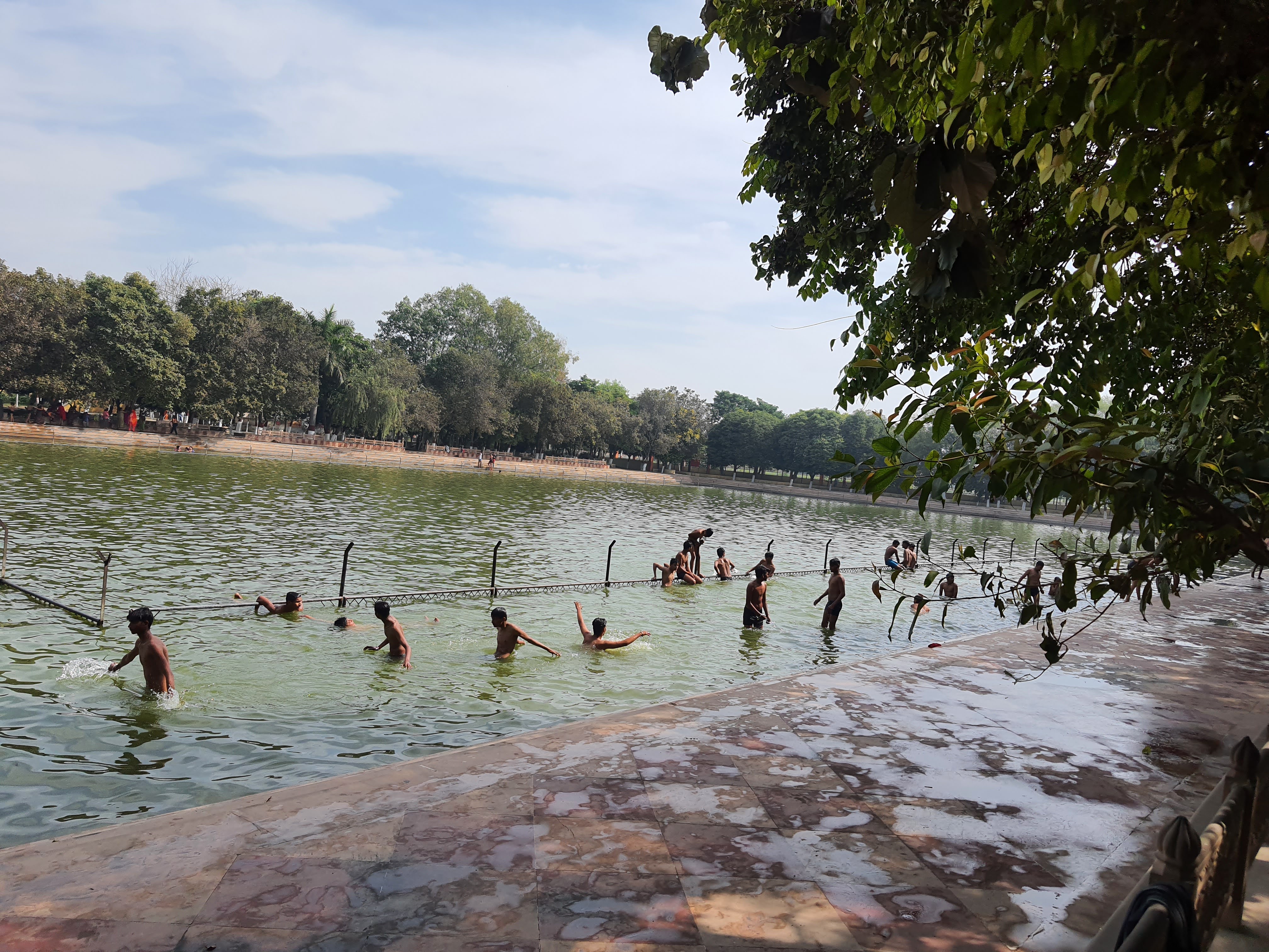 Devotees taking a dip at Raman Kund in Ramanreti, Gokul, Mahavan.