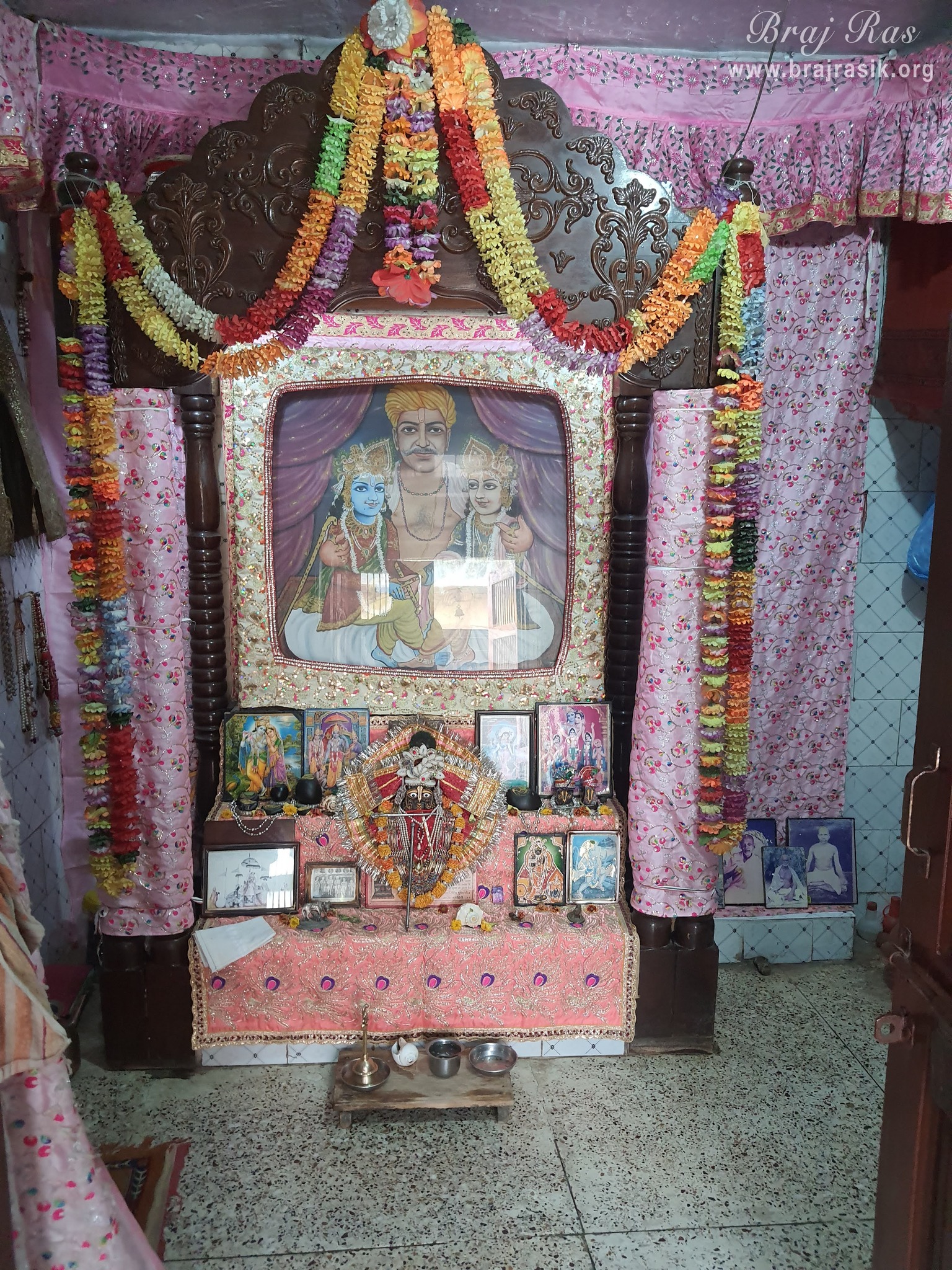 Darshan of Krishn and Balram seated on the lap of Maharaj Nand in Nand Baithak in Nandgaon.