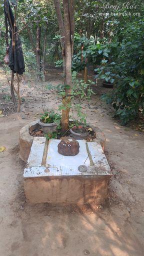 View of Govardhan Shila at the bhajan kutir of a sadhu near Vanshivat.