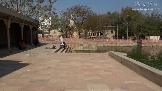 Devotees taking rest at Krishn Kund in Madhuvan - Braj.