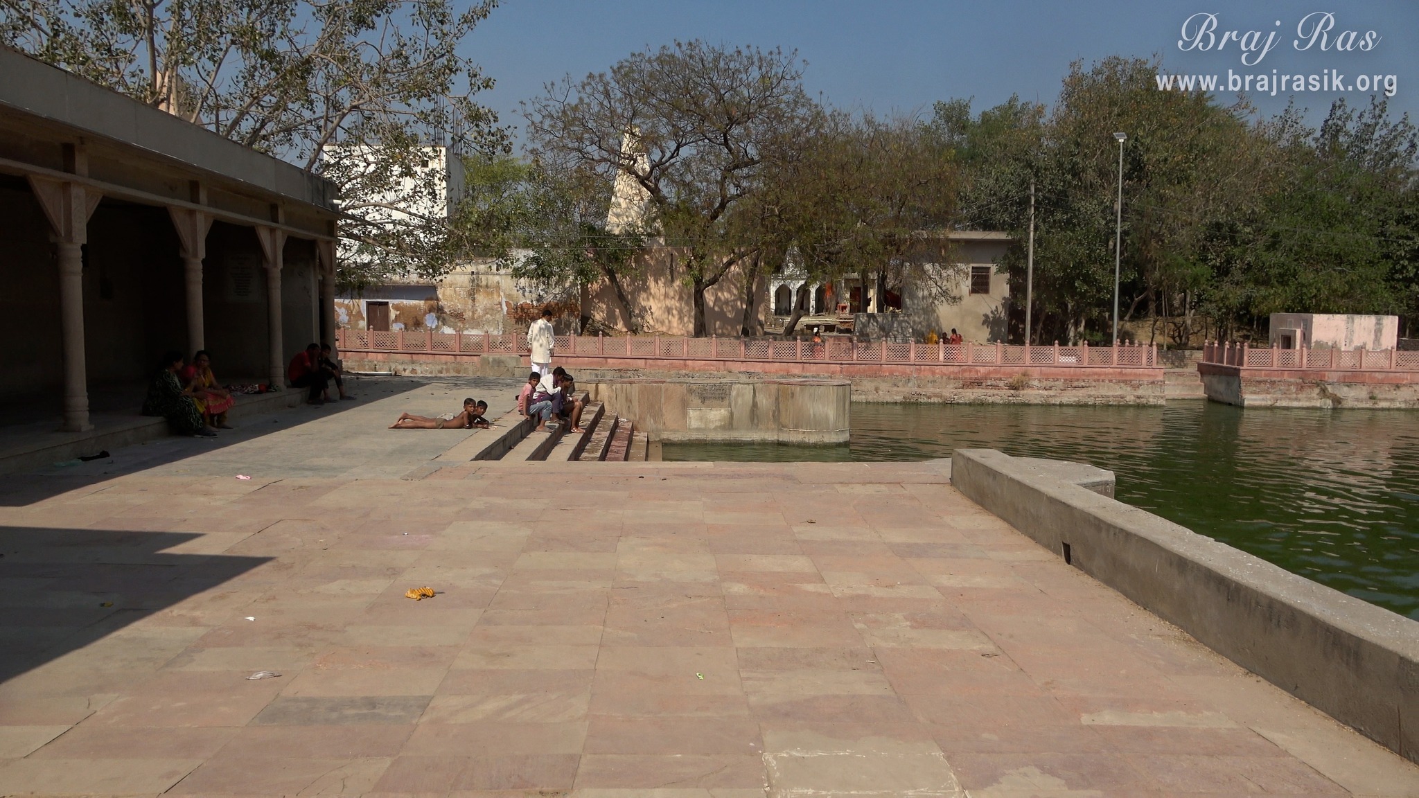 Devotees taking rest at Krishn Kund in Madhuvan - Braj.