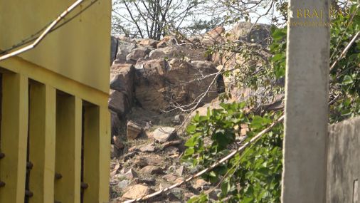 View of the rocks of Govardhan Hill behind Govind Kund, Govardhan.