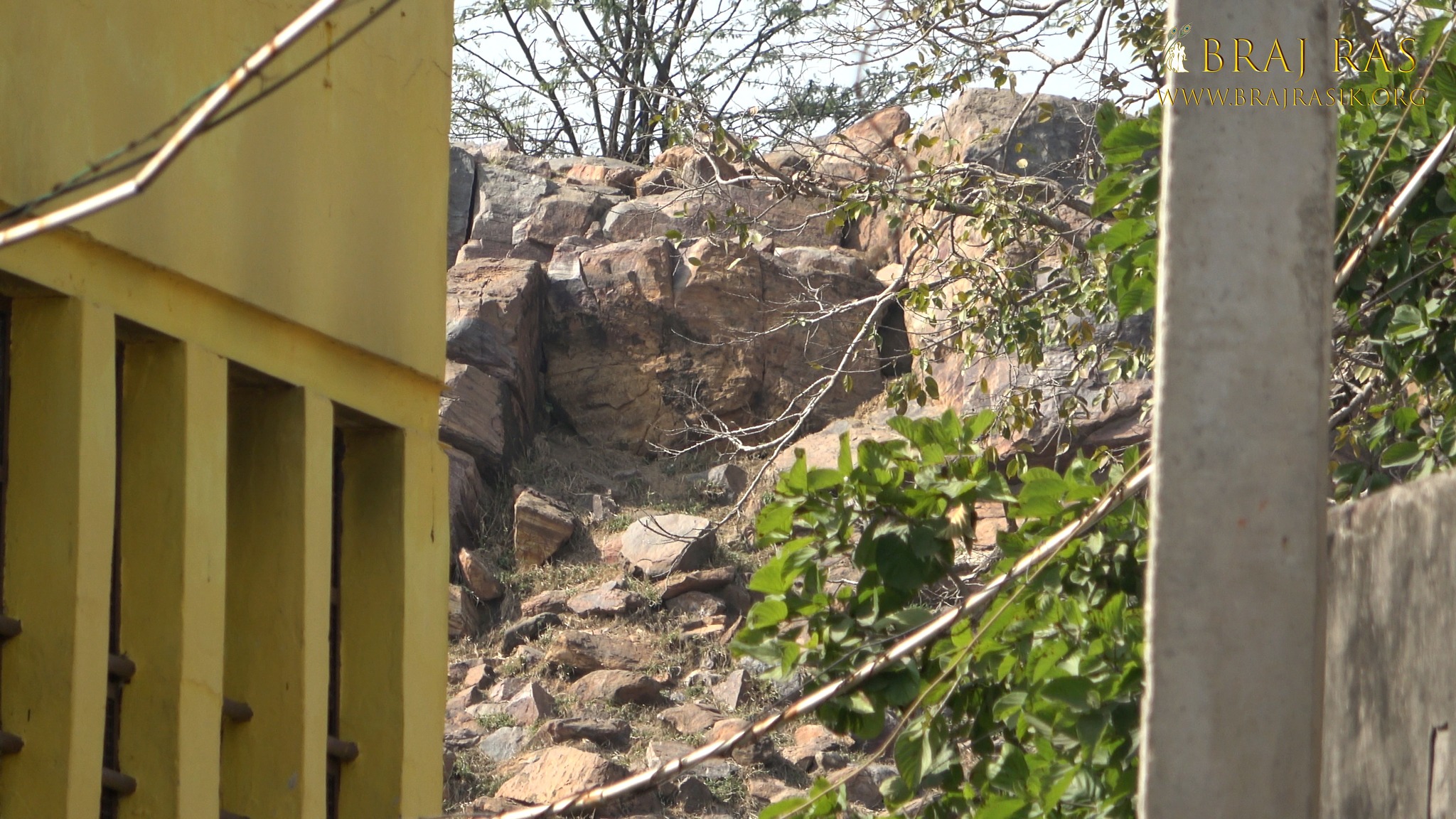 View of the rocks of Govardhan Hill behind Govind Kund, Govardhan.