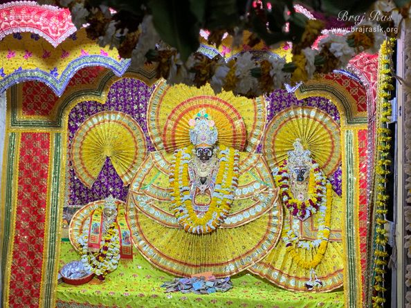Darshan of Shri Krishna who is seated on Garud Ji, Goddess Lakshmi is seated on the left of Krishna, inside Garud Govind Temple near Vrindavan.