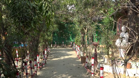 View of a path near the Kunj of Rangdevi Sakhi inside Nikunj Van at Shri Anandam Dham, Vrindavan.