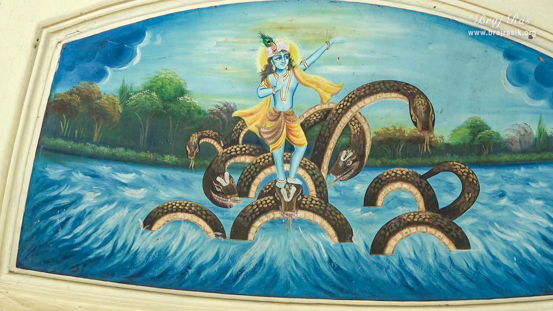 View of a painting on the wall of Kaliya Naag Temple in Jaint, depicting the pastimes of Shri Krishna dancing on the hood of Kaliya Serpent in Yamuna.