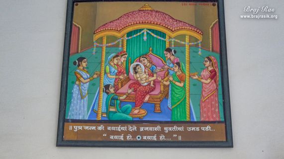 View of a painting of child Harivansh Mahaprabhu in the lap of Tararani hanging on the temple wall at the birthplace of Shri Hita Harivansh Mahaprabhu in Baad Gram, Mathura.