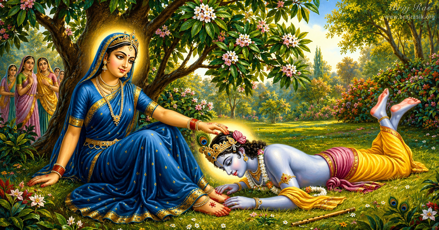 खिले हुए वृक्ष के नीचे नीली पोशाक में शालीनता से बैठी हुईं श्री राधा रानी अत्यंत कोमलता से अपना हाथ श्री कृष्ण के मस्तक पर रखती हैं, जो पूर्ण समर्पण भाव से उनके चरण-कमलों में लेटे हुए हैं, जबकि सखियाँ पीछे से यह दृश्य निहार रही हैं।